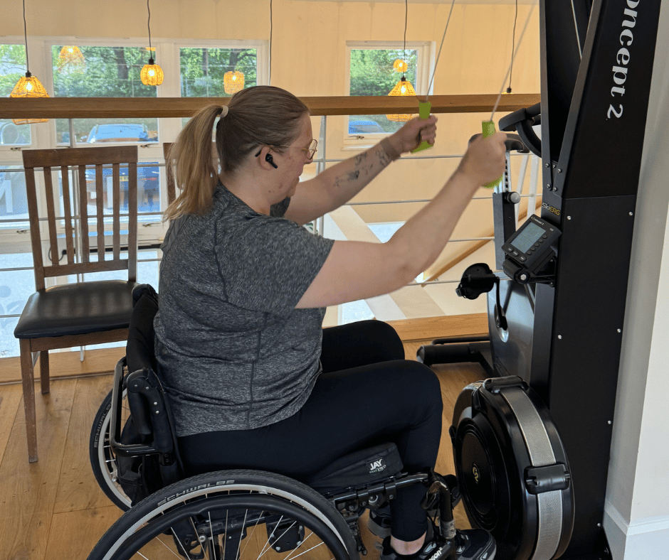 sarah sat in her wheel chair using the SkiErg